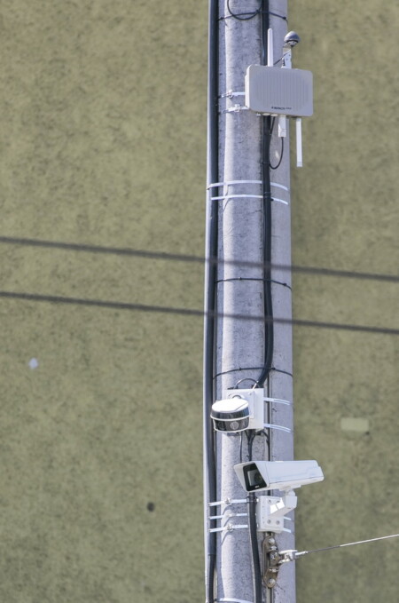 Kapsch RIS-9160 Roadside ITS Station   (top) and one of four HESAI Pandar XT32 Lidar sensors (bottom) installed at the intersection
